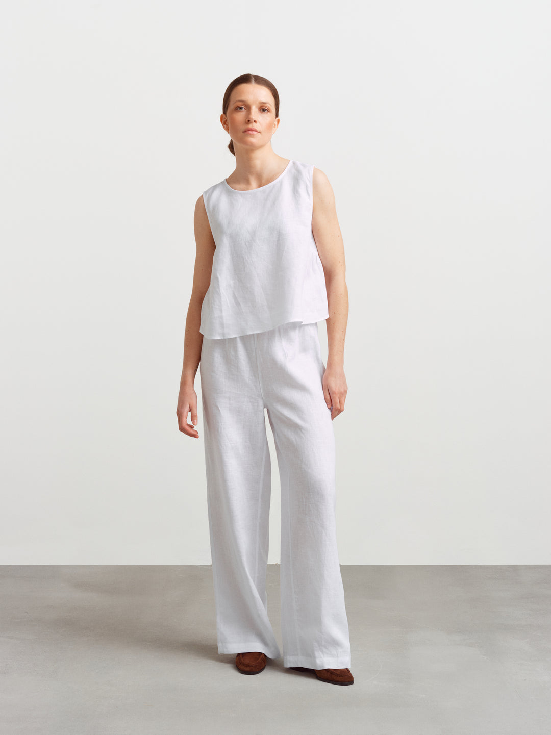 Biarritz top in white linen, full figure styled as a set with wide-leg linen trousers