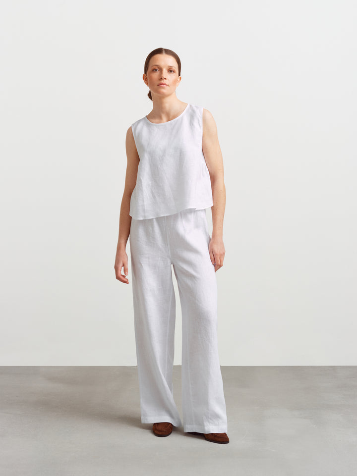 Biarritz top in white linen, full figure styled as a set with wide-leg linen trousers