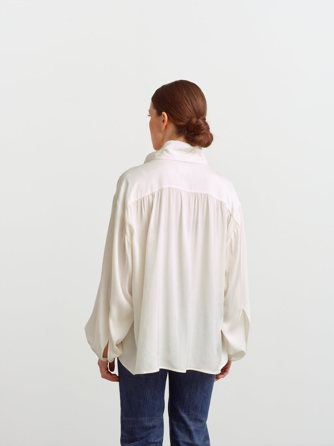 Caen blouse in cloud dancer silk blend, back view showing soft gathering across the shoulders