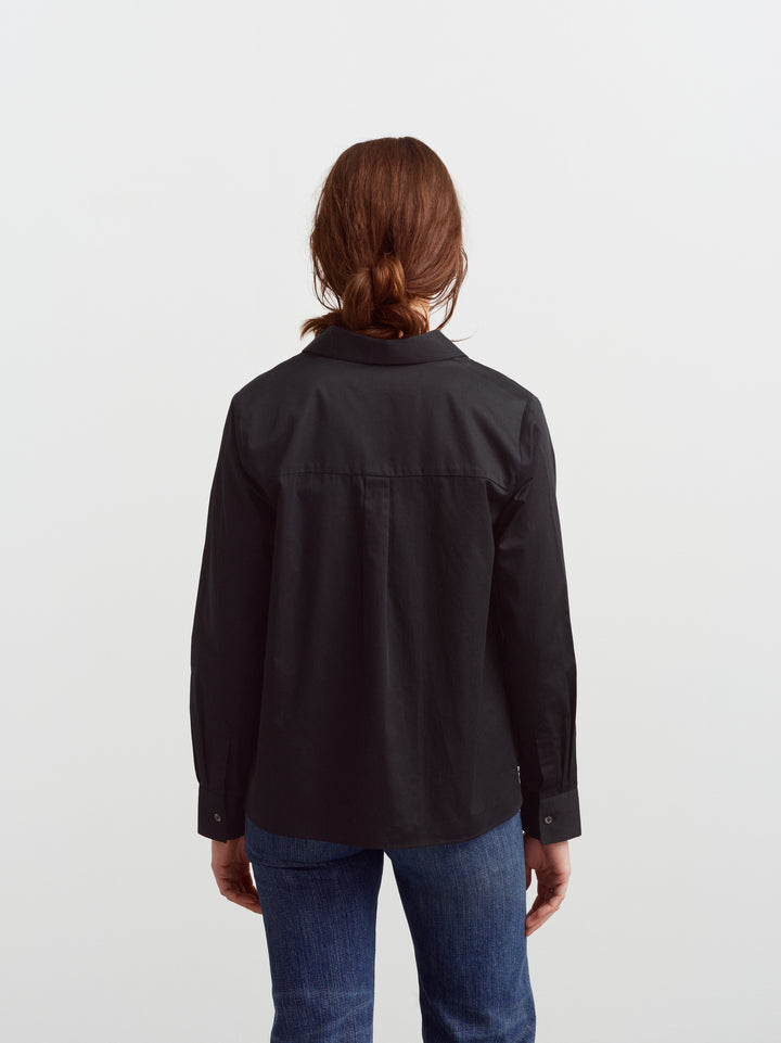 Lyon shirt in black organic cotton, back view showing the A-line shape at the hem