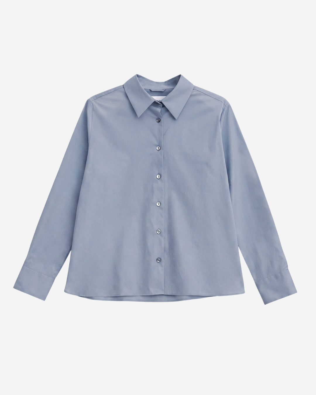 Lyon shirt in Monday blue organic cotton, flat lay with pointed collar and button-down front