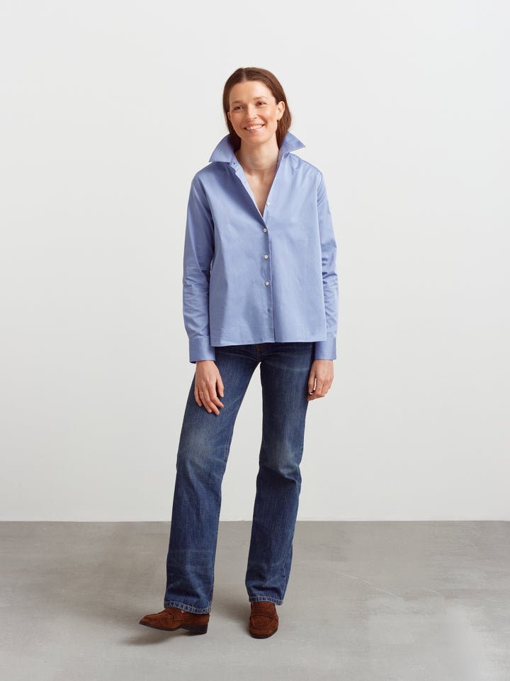Lyon shirt in Monday blue organic cotton, A-line fit with blue jeans and brown loafers
