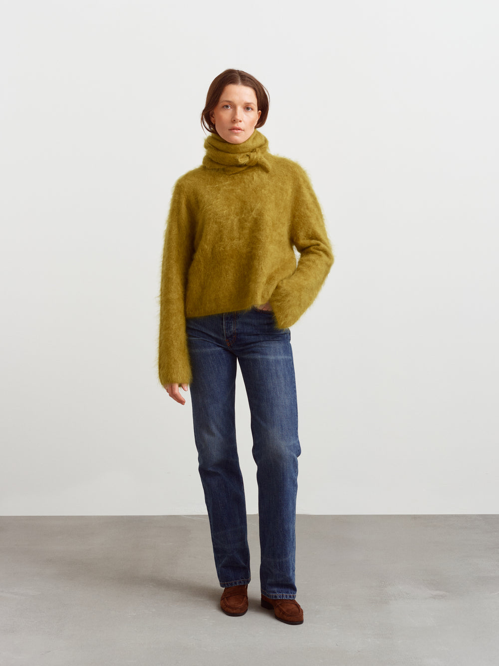 Montreal sweater in fresh moss brushed cashmere, styled with a tonal scarf and blue jeans