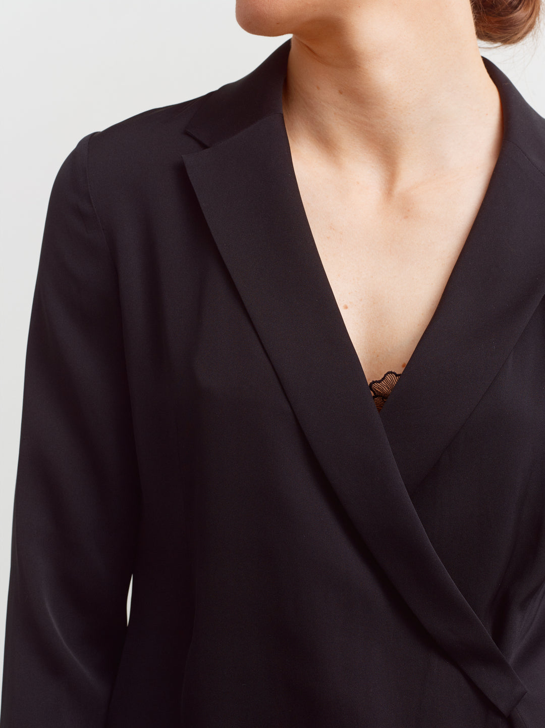 New York blouse in black silk blend, close-up of draped wrap front and notched lapel collar