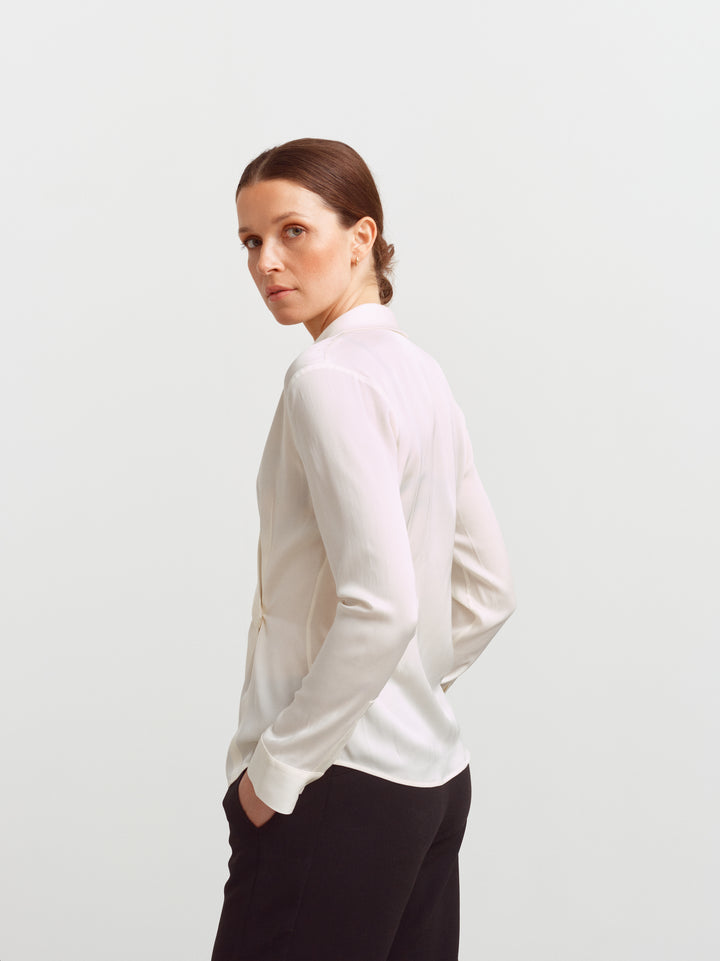 New York blouse in cloud dancer silk blend, side view showing how the fabric falls from the shoulder